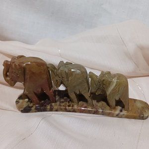 Graduated stone elephants